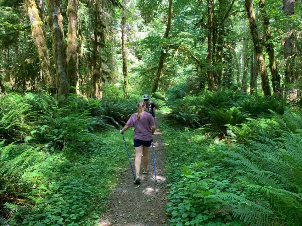 women walking in the greenery